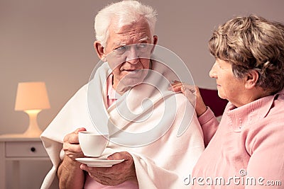 Wife supporting husband with alzheimer Stock Photo