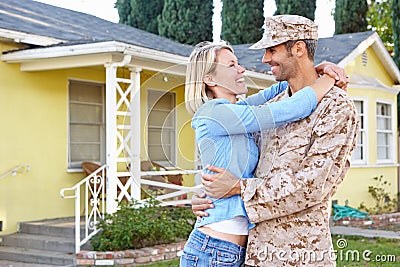 Wife Welcoming Husband Home On Army Leave Stock Photo