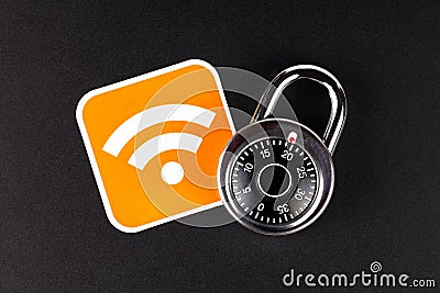 WiFi wireless network security simple abstract concept. Wifi Connection signal symbol and a coded padlock laying on black Stock Photo