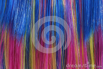 Wig of synthetic hair with colored strands for carnival Stock Photo