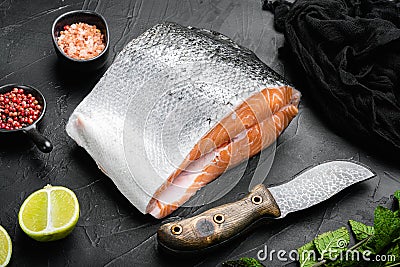 Wild Alaskan Sockeye or Coho Salmon fillet, on black dark stone table background Stock Photo