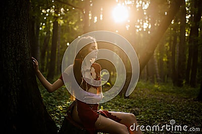 Wild attractive woman in forest. Folklore character. Female spirit mythology. Living wild life untouched nature. Sexy Stock Photo