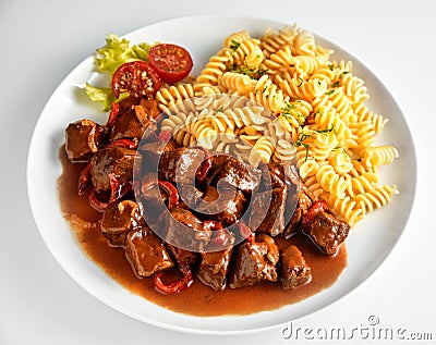 Wild deer venison goulash with fusilli pasta Stock Photo