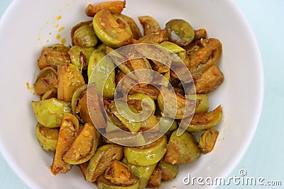 Wild eggplant dry fry, Solanum aethiopicum, traditional local food Stock Photo