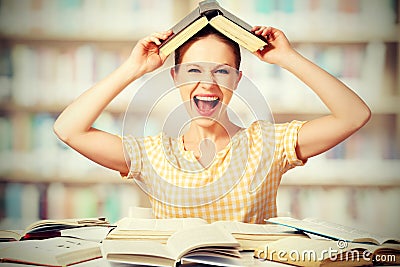 Wild girl student with glasses shouts with books Stock Photo