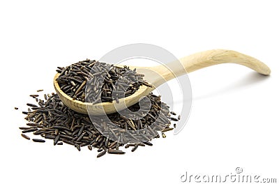 Wild rice in a wooden spoon Stock Photo