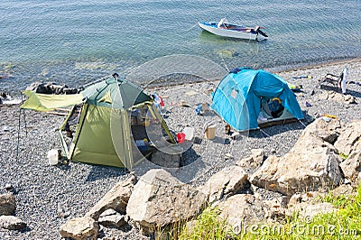 Wild tourist camping on desert beach on the russian reserve isle Stock Photo