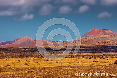 Wild volcanic landscape of Los Volcanes Natural Park in Lanzarote, Canary Islands, Spain Stock Photo