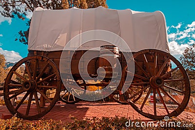 Wild West Wagon Wheel caravan retro vintage Stock Photo