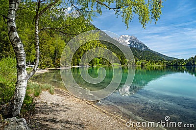 Wilder Kaiser mountain range reflected in idyllic Hintersteiner See, Scheffau, Tyrol, Austria, Europe Stock Photo