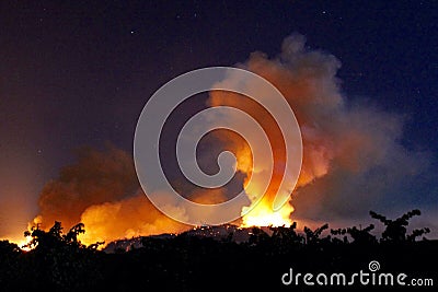 Wildfire smoke plume at night Stock Photo