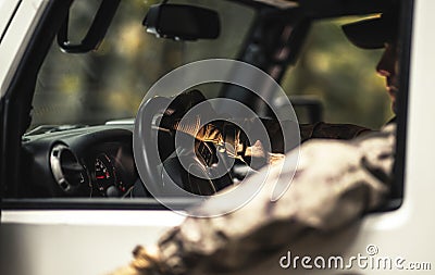 Wildlife Hunter Inside Sport Utility Vehicle Stock Photo