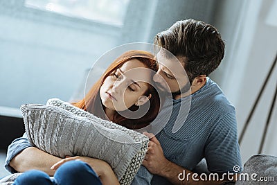 Sad unhappy couple sitting together Stock Photo
