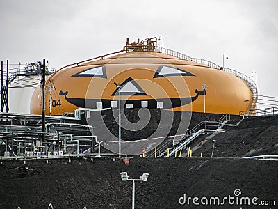 Smilin` Jack, world`s largest jack o`lantern, oil refinery storage tank, Wilmington, California painted each Halloween Editorial Stock Photo