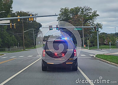 Wilmington, Delaware, U.S.A - September 30, 2023 - A state trooper SUV roaming the street with the siren on Editorial Stock Photo