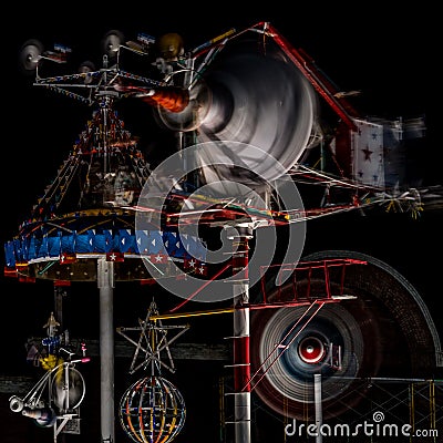 Whirligigs spin at night Editorial Stock Photo