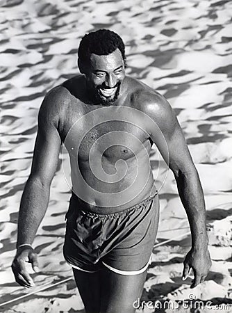 Wilt Chamberlain Playing Volleyball on Santa Monica Beach Editorial Stock Photo