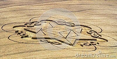 Crop circle appeared on the field - unbeliev Stock Photo