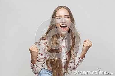 Win! Emotional blonde woman shout and have a happiness look and Stock Photo