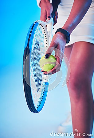 Win your service game and the results will follow. an unrecognizable young female tennis player getting ready to serve Stock Photo