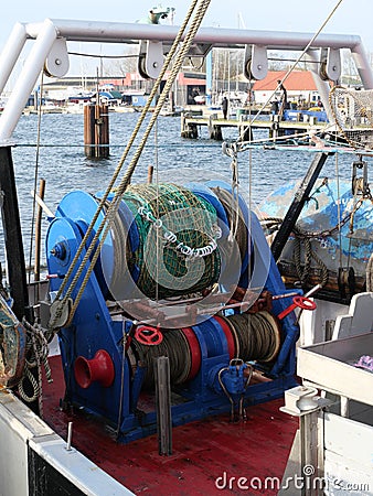 A winch for hauling in the trawl net on a fishing cutter Stock Photo