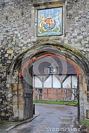 WINCHESTER, UK - FEBRUARY 5, 2017: The Priory Gate with Coat of Arms at the entrance of the old city Editorial Stock Photo