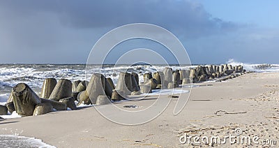 Wind breaker at the coast in Sylt in bad weather, Hoernum Stock Photo