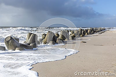 Wind breaker at the coast in Sylt in bad weather, Hoernum Stock Photo