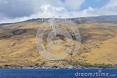 Wind farm on mountains of west maui along coast Stock Photo