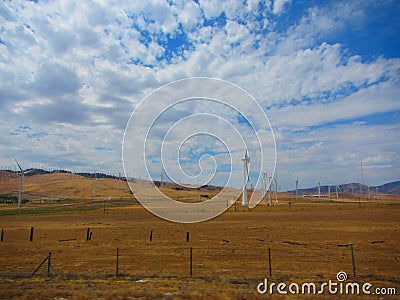 Wind farm, view of hundreds of wind trubines in mountainous fields in California. Stock Photo