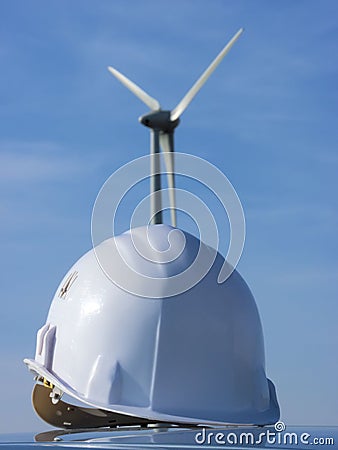 Wind mil and helmet Stock Photo