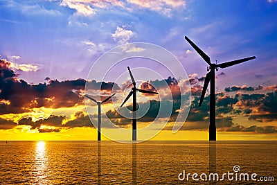 Wind power under sunset Stock Photo