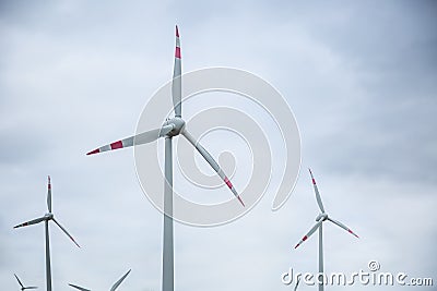 Wind power. Wind energy. Electrical energy. Several wind turbines in power generation Stock Photo