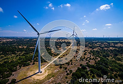 Wind Turbine Farm in Central Texas producing Clean renewable energy from sustainable wind energy Stock Photo