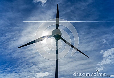 Wind turbine and passing aircraft, England Stock Photo