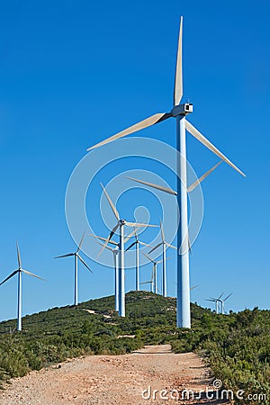 Wind turbines on beautiful sunny summer mountain landscape Stock Photo