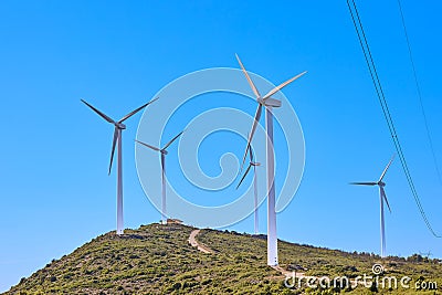 Wind turbines on beautiful sunny summer mountain landscape Stock Photo