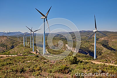 Wind turbines on beautiful sunny summer mountain landscape Stock Photo