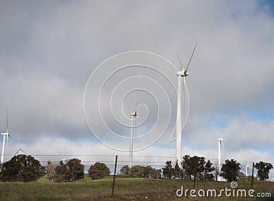 Wind Turbines on a Countryside Hill Stock Photo