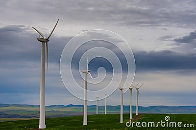 Wind turbines early in early dawn light Stock Photo