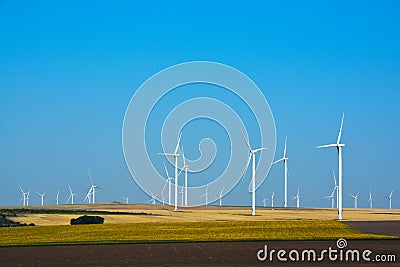 Wind turbines farm on a rural background Stock Photo