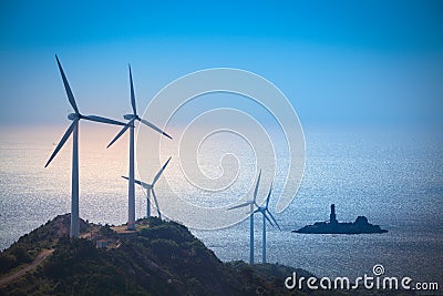 Wind turbines generating electricity at the beach Stock Photo