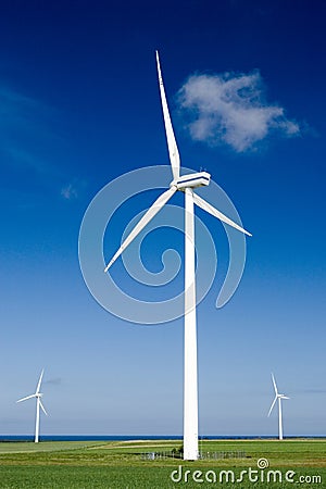 Wind turbines in green field Stock Photo