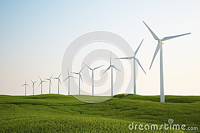 Wind turbines on green grass field Stock Photo