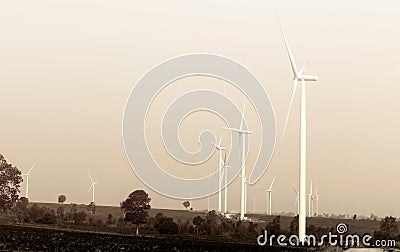 Wind turbines on sky in sepia color filter Stock Photo