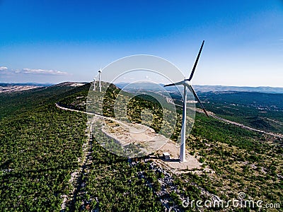 Wind turbines or windmills in desert landscape in Croatia Stock Photo