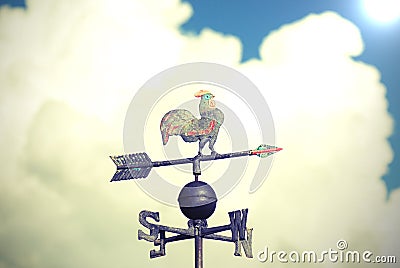 Wind vane to indicate the wind direction made of metal with a ro Stock Photo