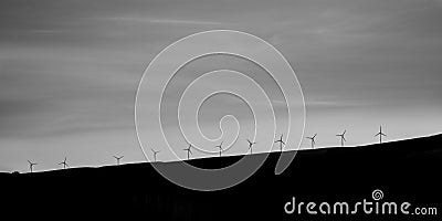 Windfarm in Scotland - a line of wind turbines on a hill on Isle of Skye Stock Photo