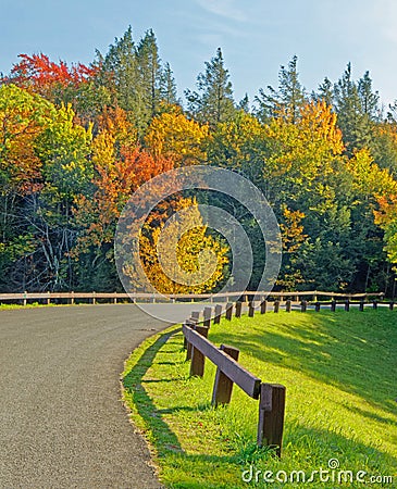 winding, curving road with wooden side railings early Fall Catskill Mountains Stock Photo