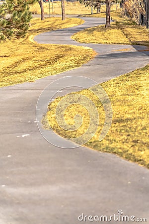 Winding footpath or narrow rural road Stock Photo